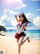 A woman in a sailor outfit is dancing on the beach.