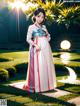 A woman in a white and red dress standing in a garden.